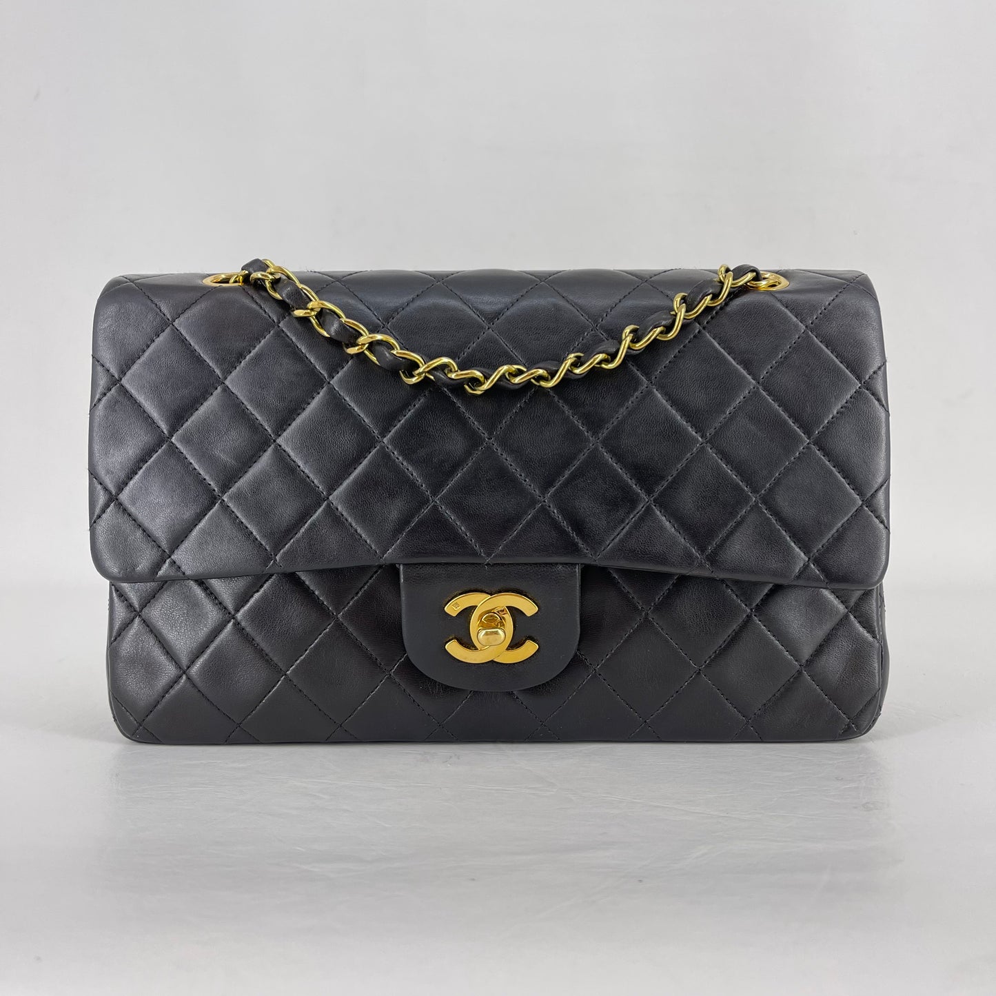 Authentic Chanel Black Lambskin 10” Double Flap Bag
